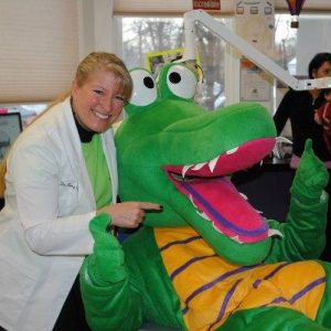 Picture of Dr. Nancy Villa with the Kidzdent mascot chompers