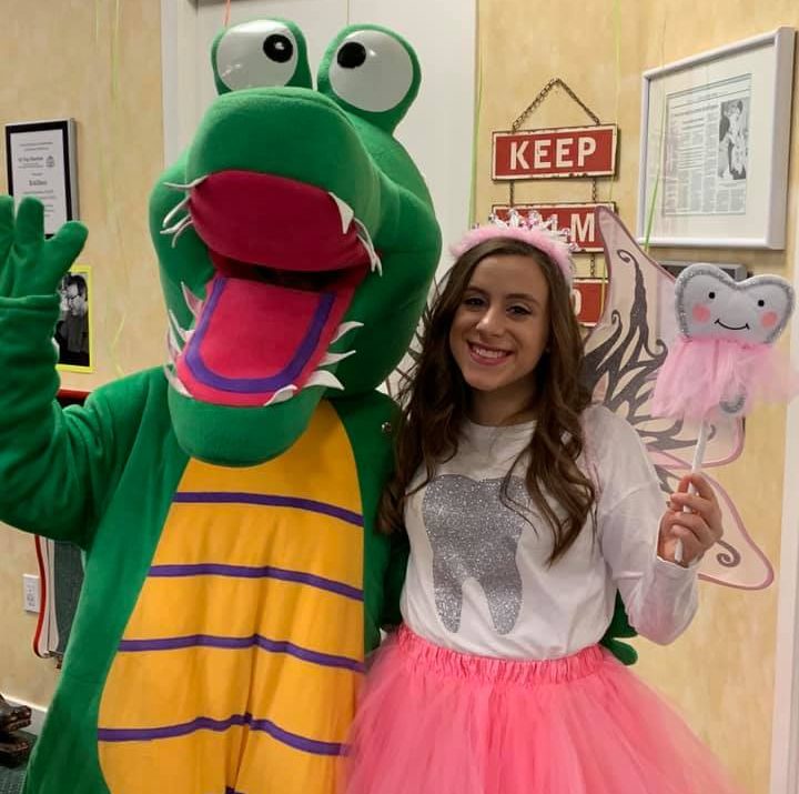photo of the kidzdent mascot with a team member dressed as the Tooth Fairy