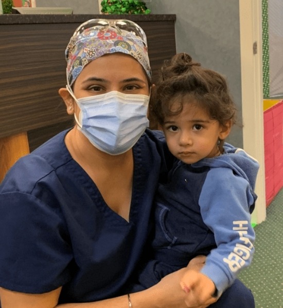 staff and child at Kidzdent